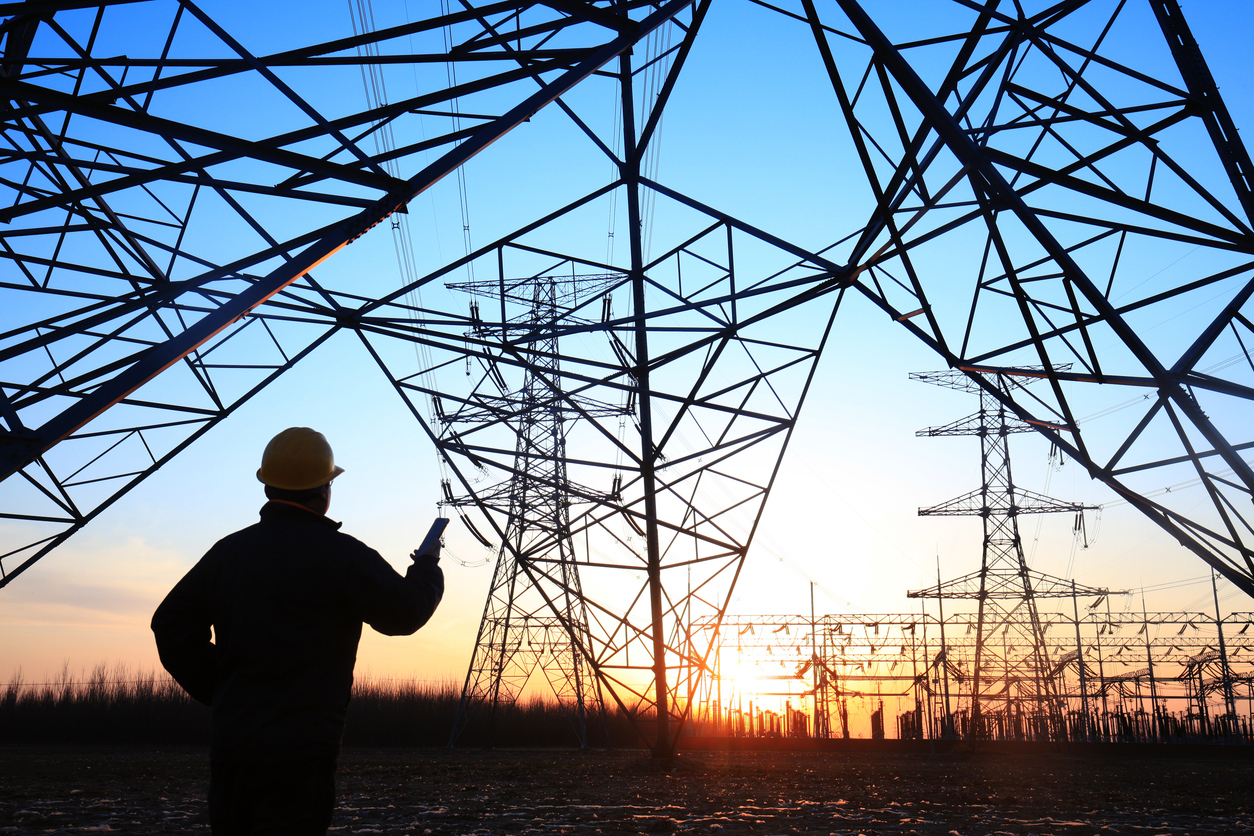 electricity-workers-and-pylon-silhouette