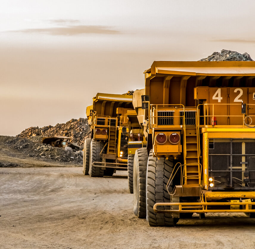 large-mining-rock-dump-trucks-transporting-platinum-ore-for-processing-2